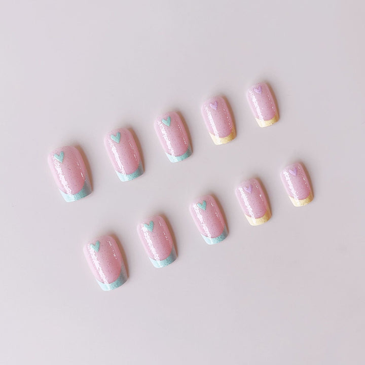 Artificial nail set with playful color gradients and heart motifs Stornfield