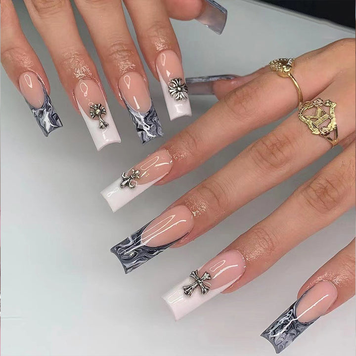 Exquisite artificial nails with textured designs and jewelry accents Stornfield