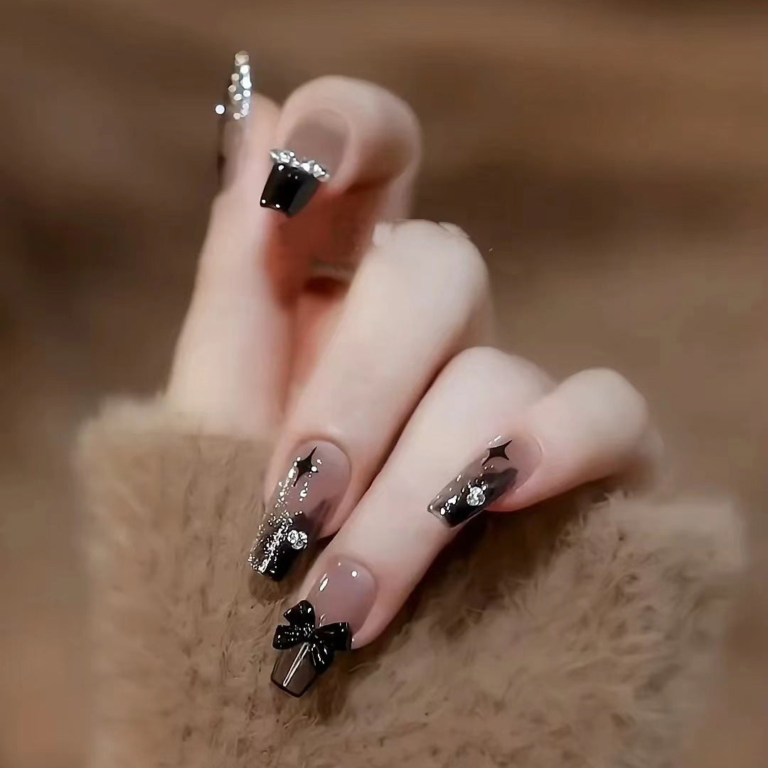 Artificial nails with heart design and glamorous accents Stornfield