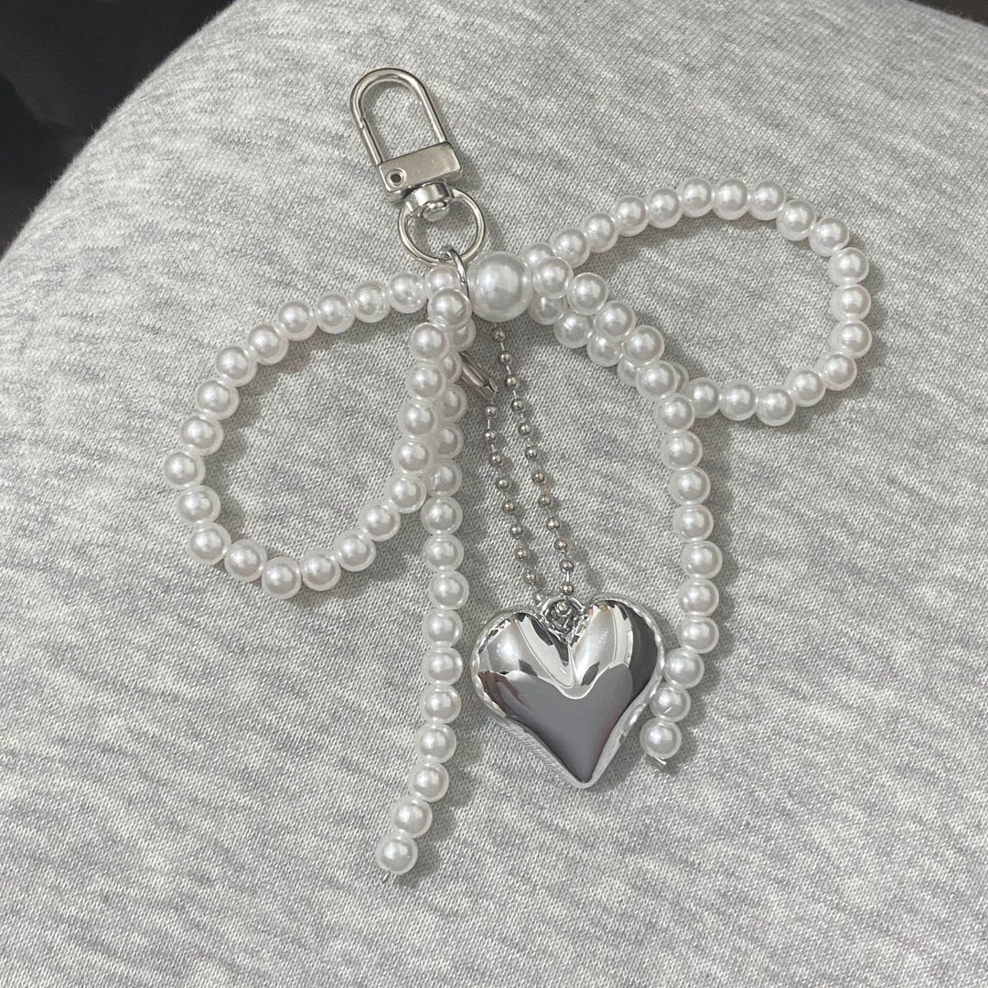 Elegant Pearl Bow Keychain Stornfield