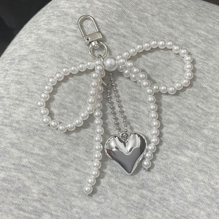 Elegant Pearl Bow Keychain Stornfield