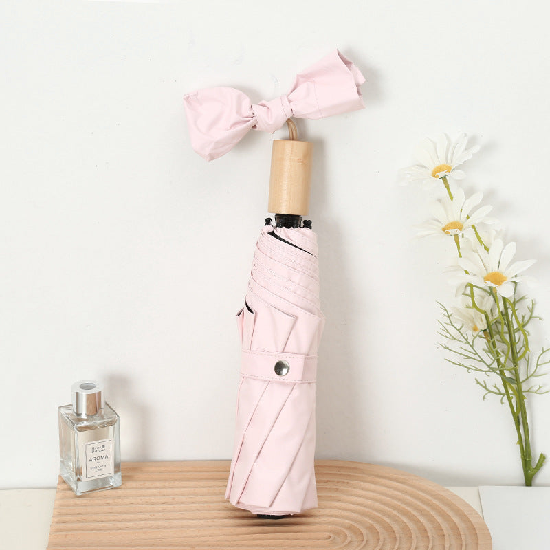Ladies compact folding umbrella with elegant design and ergonomic wooden handle Stornfield