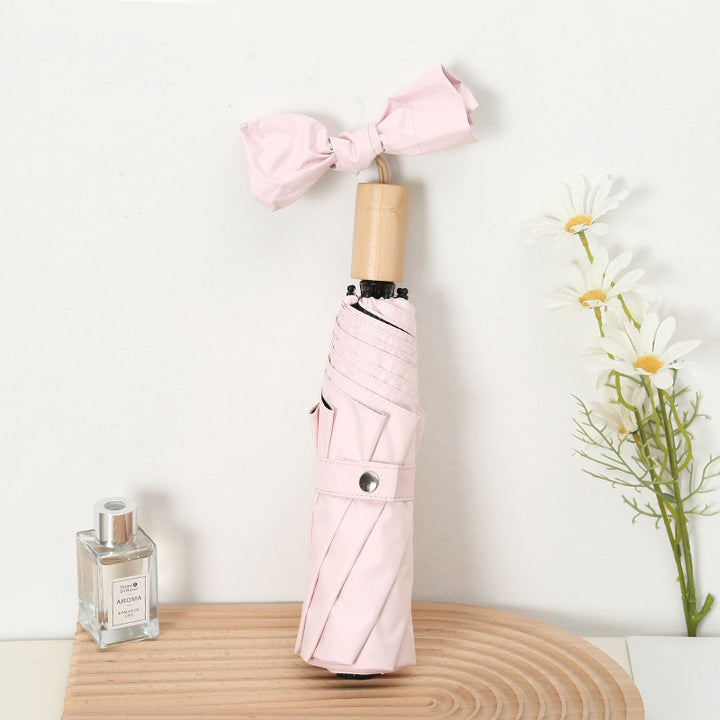 Ladies compact folding umbrella with elegant design and ergonomic wooden handle Stornfield