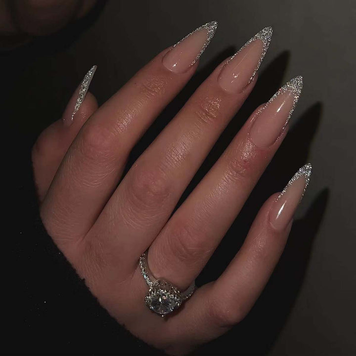 Glamorous stiletto artificial nails with glitter tips Stornfield