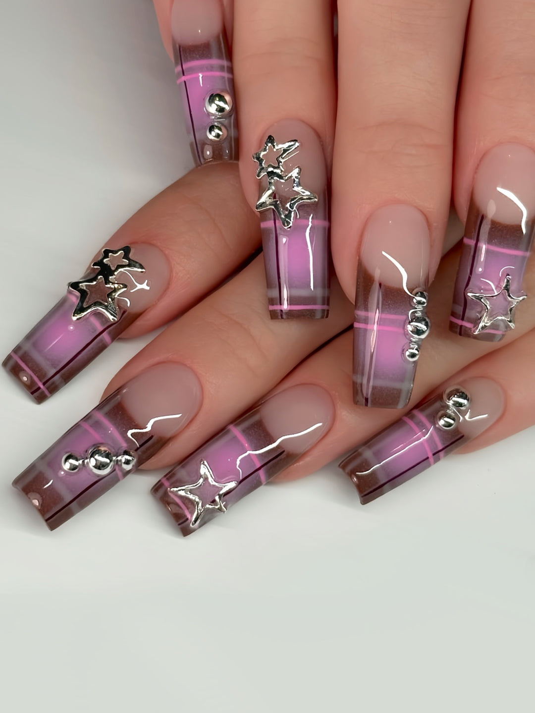 Artistic Star-Embellished Nail Art Stornfield