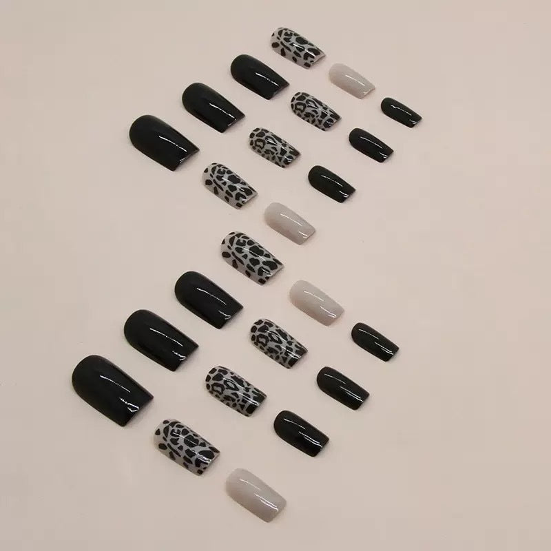 Acrylic nail set with stylish leopard pattern and elegant accents Stornfield