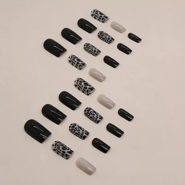 Acrylic nail set with stylish leopard pattern and elegant accents Stornfield