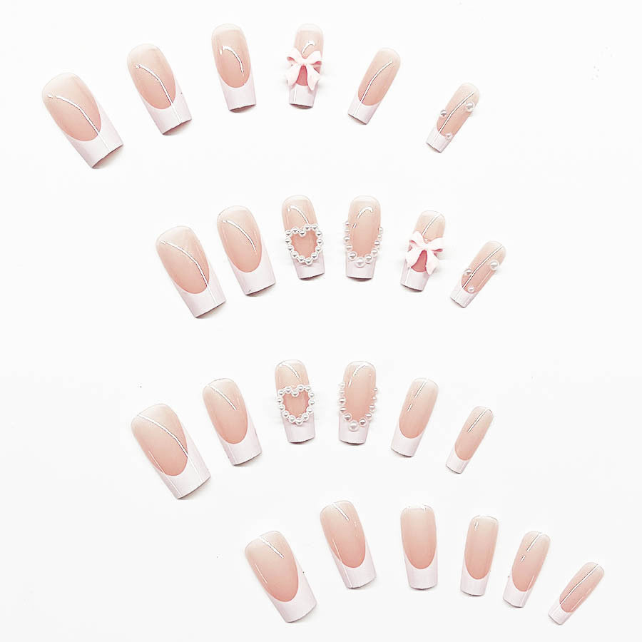 Artificial nail set with elegant 3D flowers and pearl embellishments Stornfield