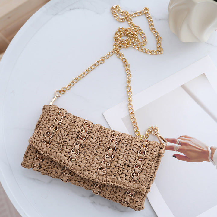 Clutch with chain shoulder strap and handcrafted macrame closure Stornfield
