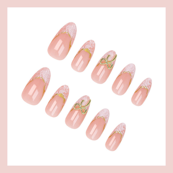 Acrylic nail set with elegant tips and delicate embellishments Stornfield