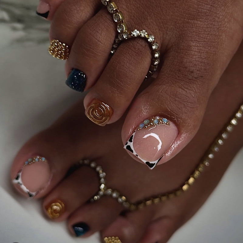 Artful toenail design with floral and sparkling accents Stornfield