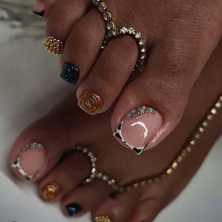 Artful toenail design with floral and sparkling accents Stornfield