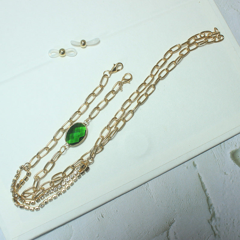 Elegant necklace with green stone and golden accents Stornfield