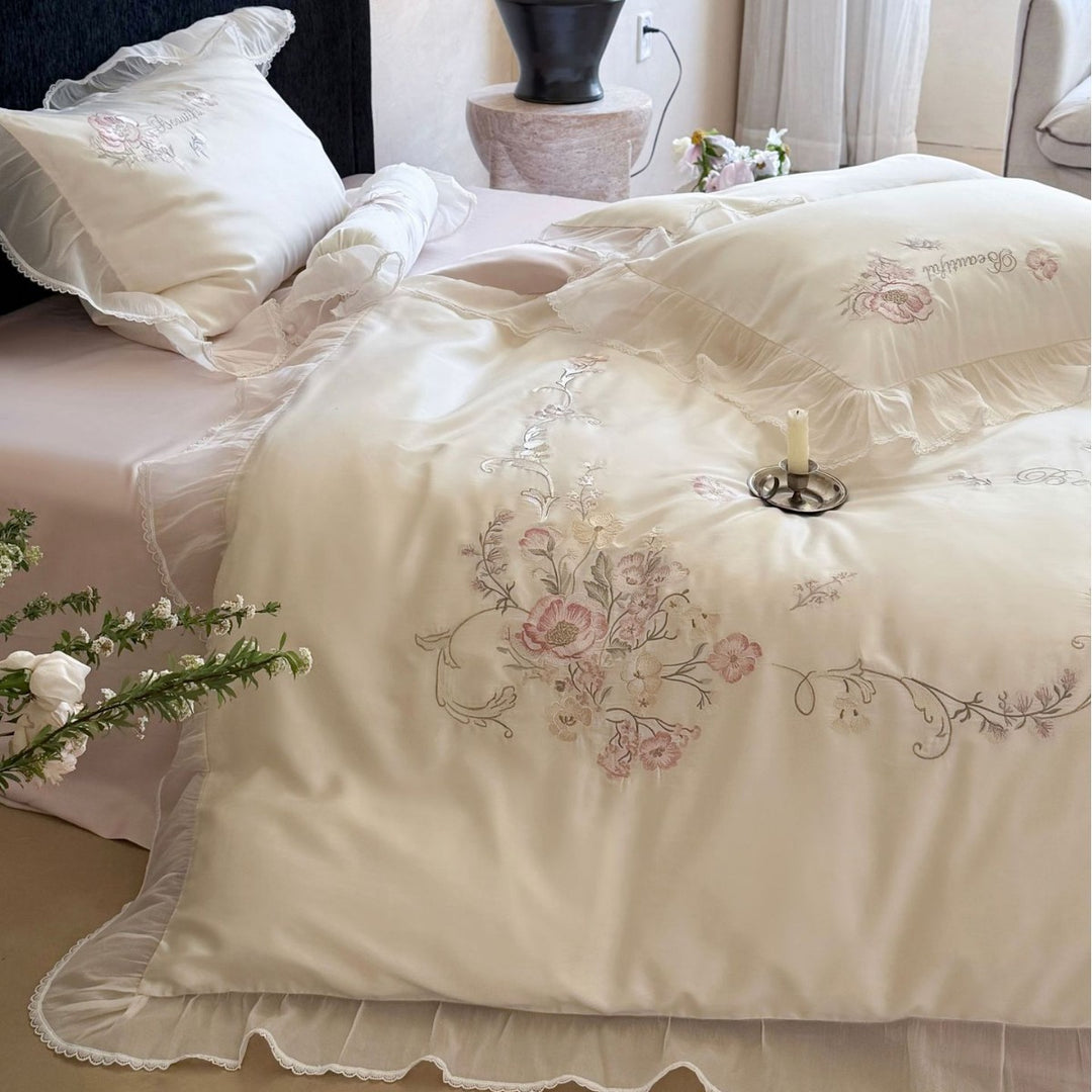Embroidered satin bedding set with frill, ruffles, and decorative pillow