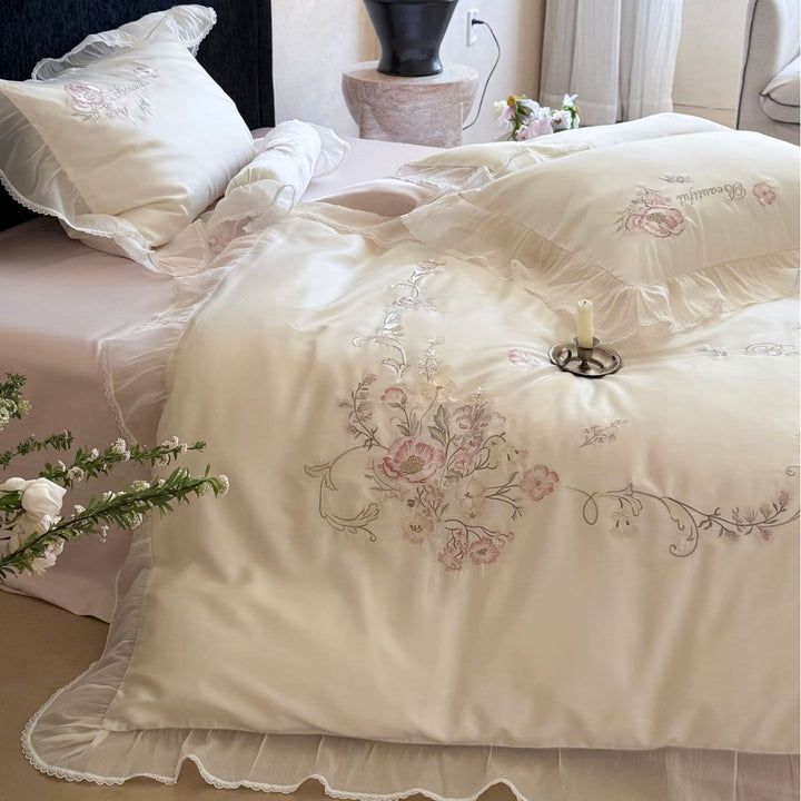 Embroidered satin bedding set with frill, ruffles, and decorative pillow