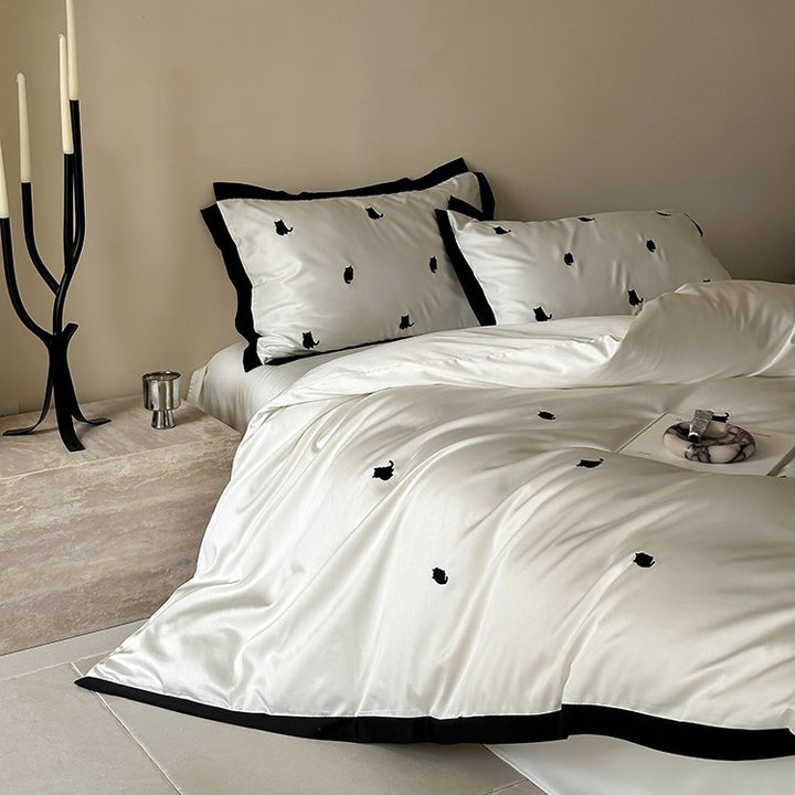 Luxurious satin bedding set with cherry embroidery and contrasting trim