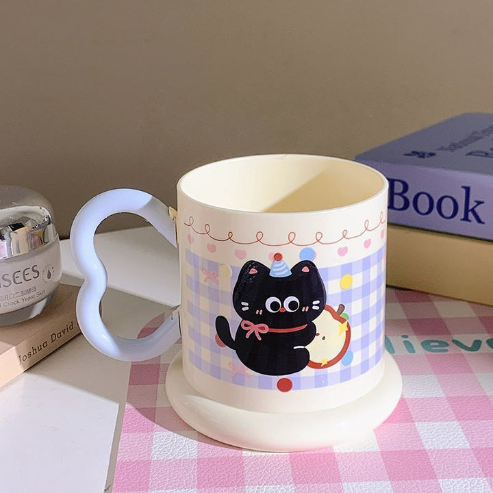 Ceramic mug with playful cat motif Stornfield