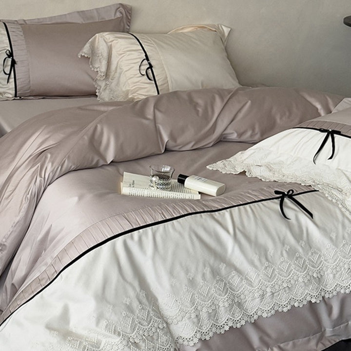 Fine cotton satin bedding set with lace ruffle, contrasting decorative ribbons and hotel closure