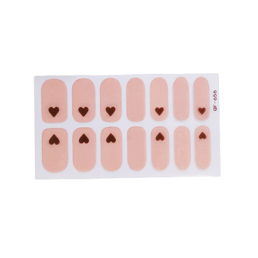 Artificial nail art with heart-shaped designs and soft color gradients Stornfield