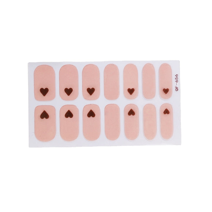 Artificial nail art with heart-shaped designs and soft color gradients Stornfield