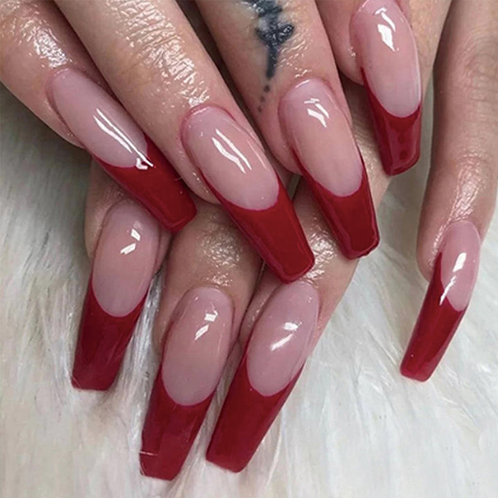 Elegant artificial nails with high-gloss finish and prominent French tip Stornfield