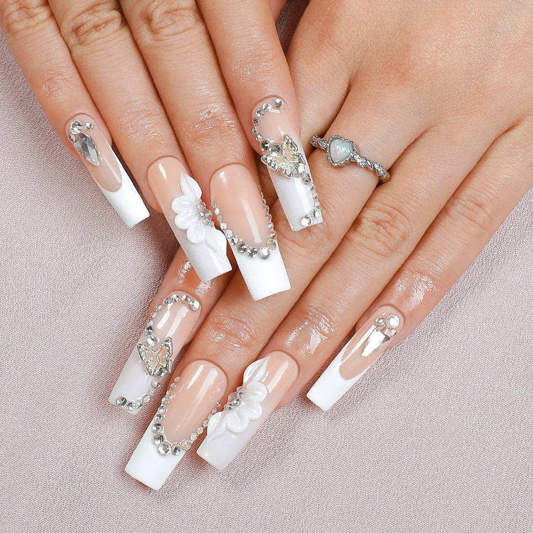 Artificial nail set with elegant glitter and flower motifs Stornfield
