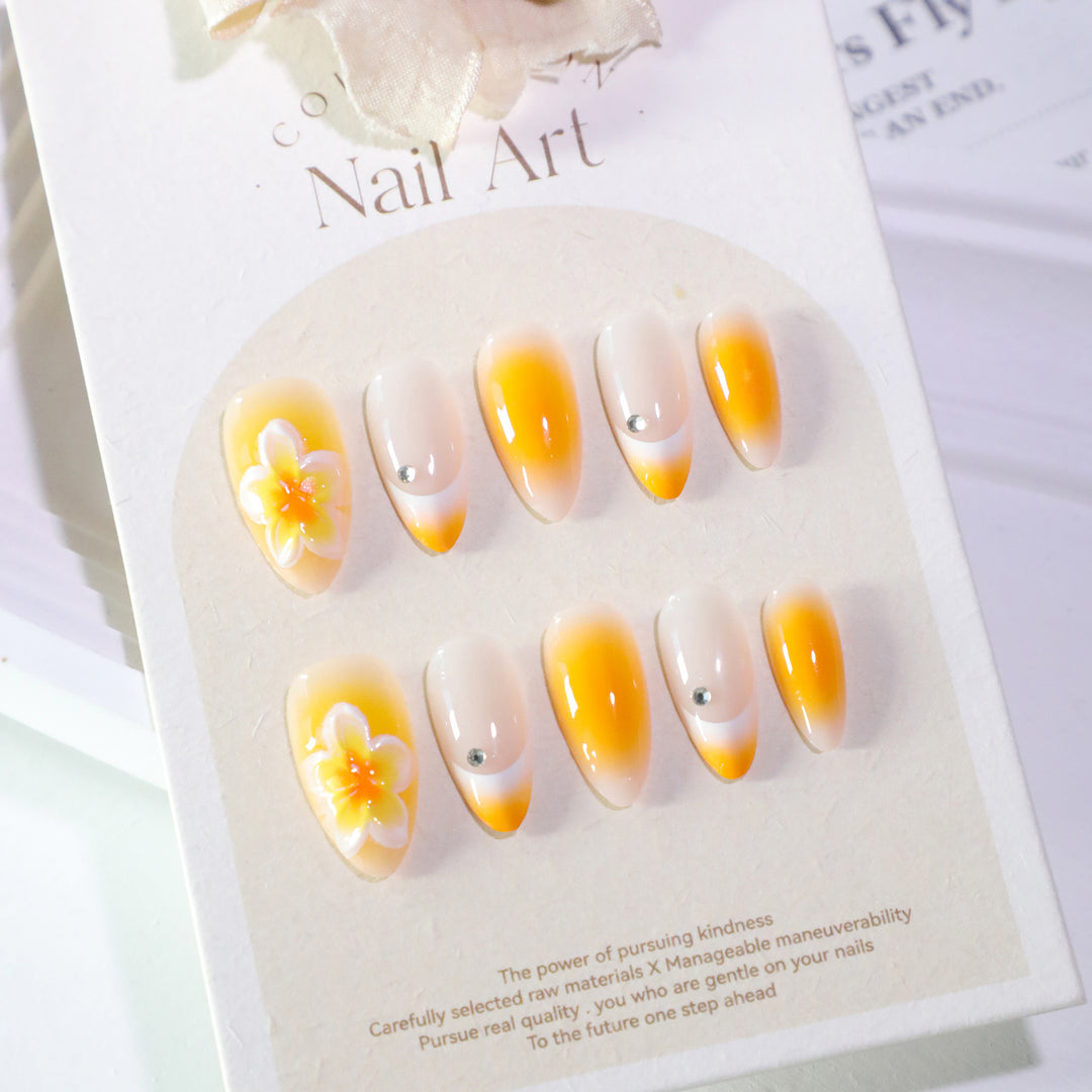 Artful nail extensions with delicate ombre effect and floral accents Stornfield
