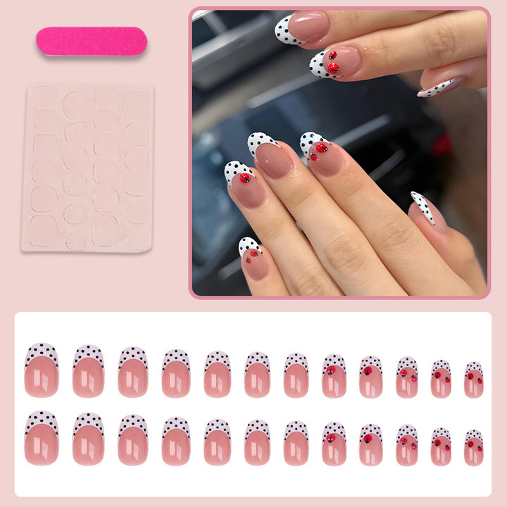 Artificial nail set with playful dots and eye-catching accents Stornfield