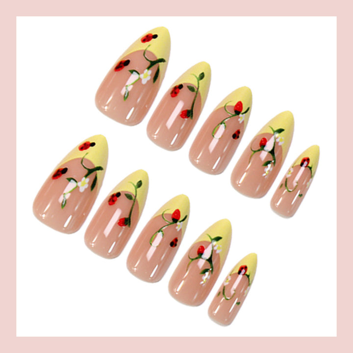 Artificial nail set with elegant gradient and floral accents Stornfield