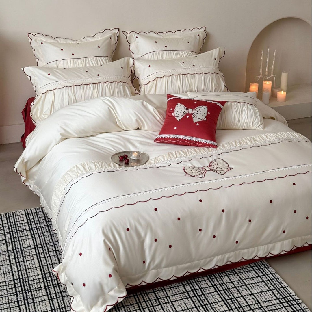 Elegant cotton satin bedding set with decorative bow appliqué and gathered frill