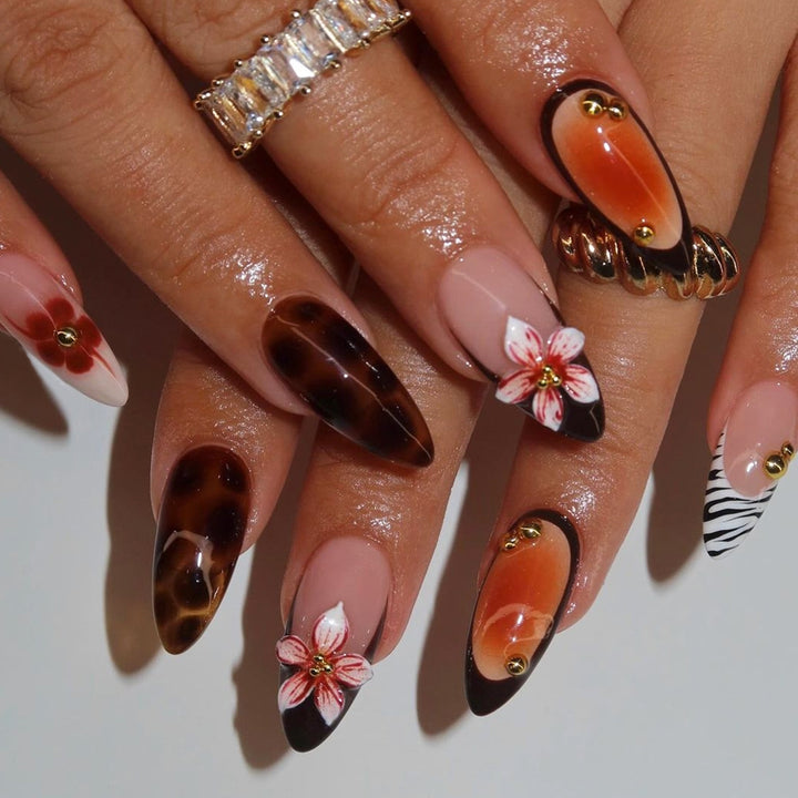 Artificial nail set with floral and creative decorations Stornfield