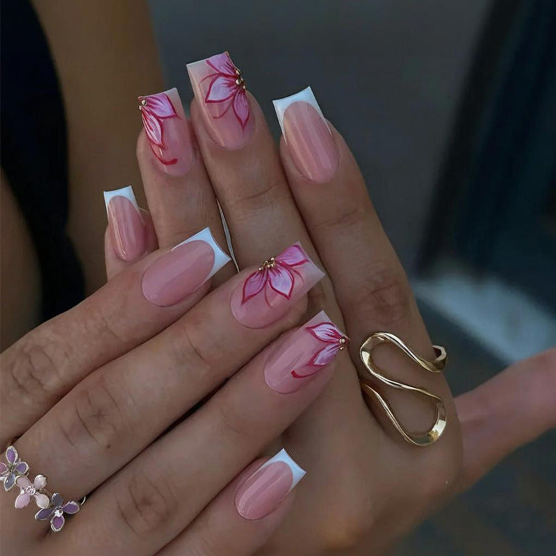 Artificial nail set with elegant flower designs and glitter accents Stornfield