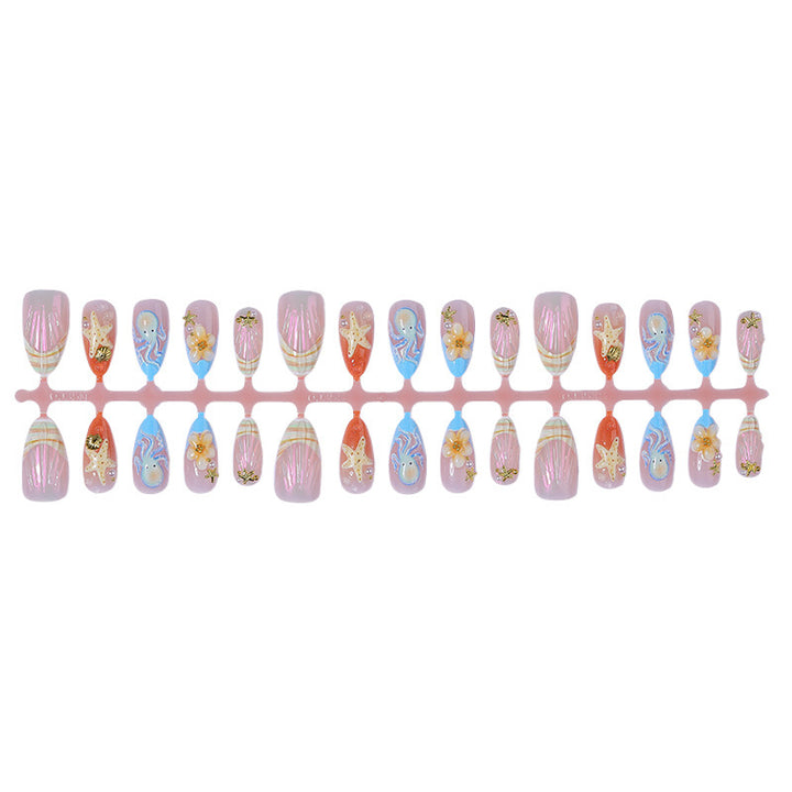 Creative nail art set with maritime designs and elegant embellishments Stornfield