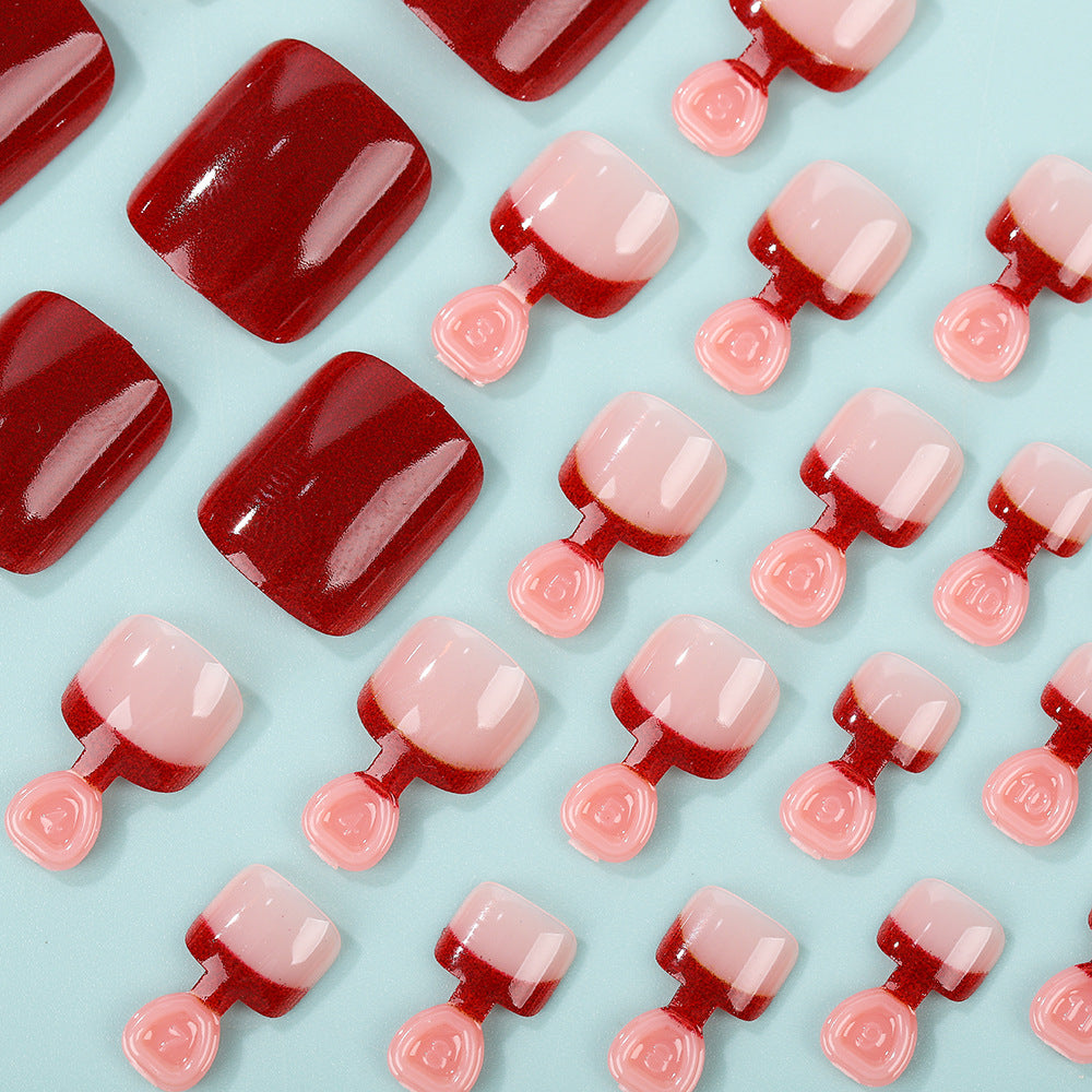 Acrylic nail set in elegant red and nude design Stornfield