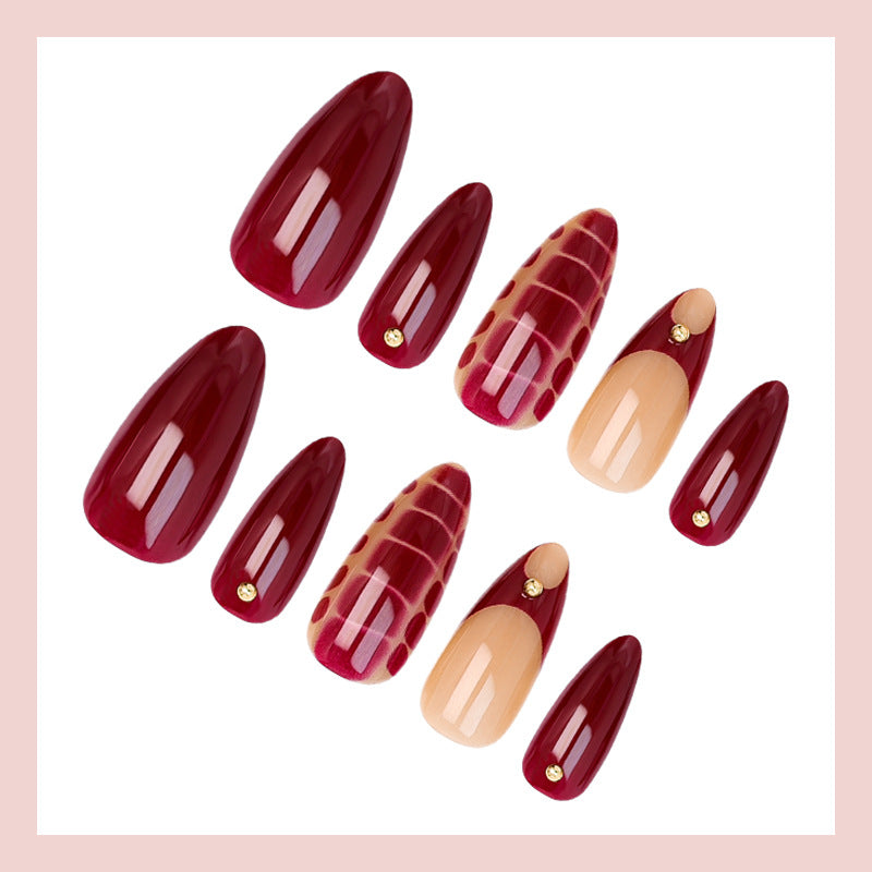Acrylic nail set with elegant golden accents and trendy design Stornfield