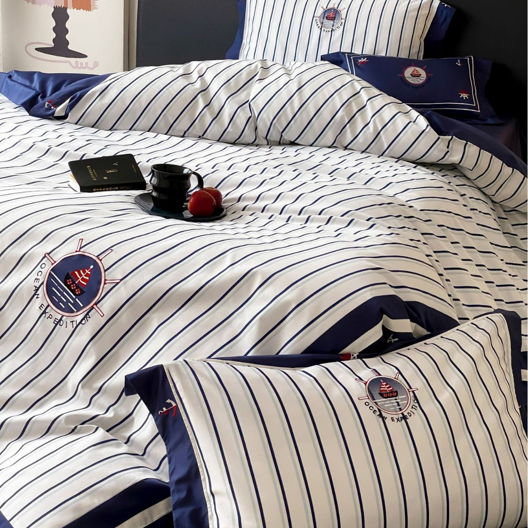 Maritime cotton satin bedding set with fine stripes, nautical embroidery, and reversible pillow
