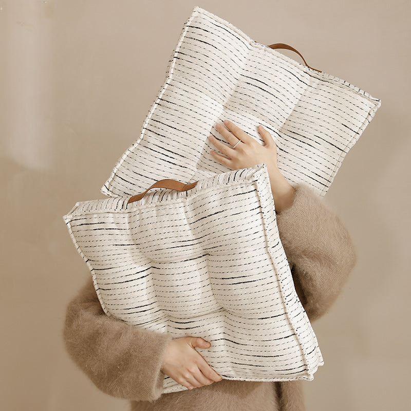 Padded square seat and floor cushion with quilted tufted padding and carrying handle Stornfield