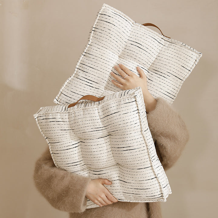 Padded square seat and floor cushion with quilted tufted padding and carrying handle Stornfield