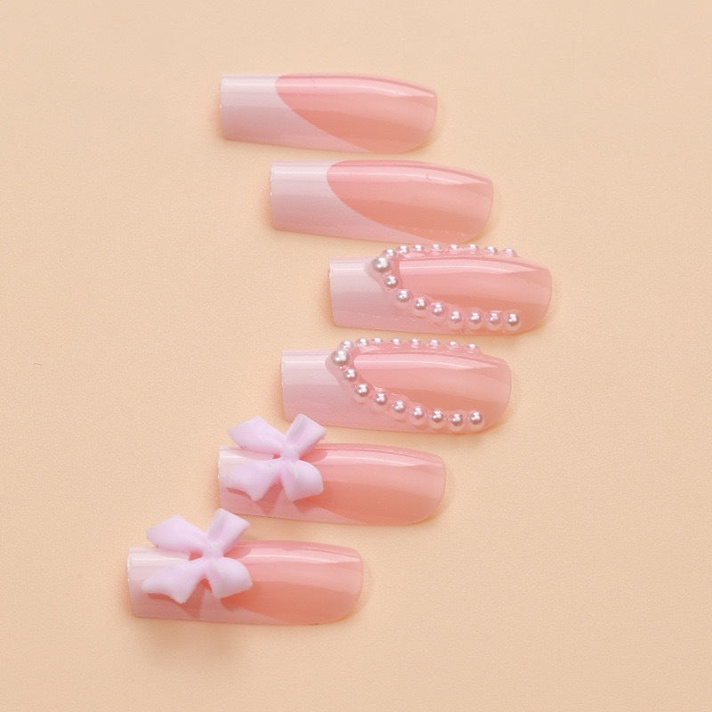 Artificial nails with delicate flower and pearl embellishments Stornfield