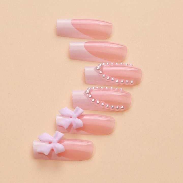 Artificial nails with delicate flower and pearl embellishments Stornfield