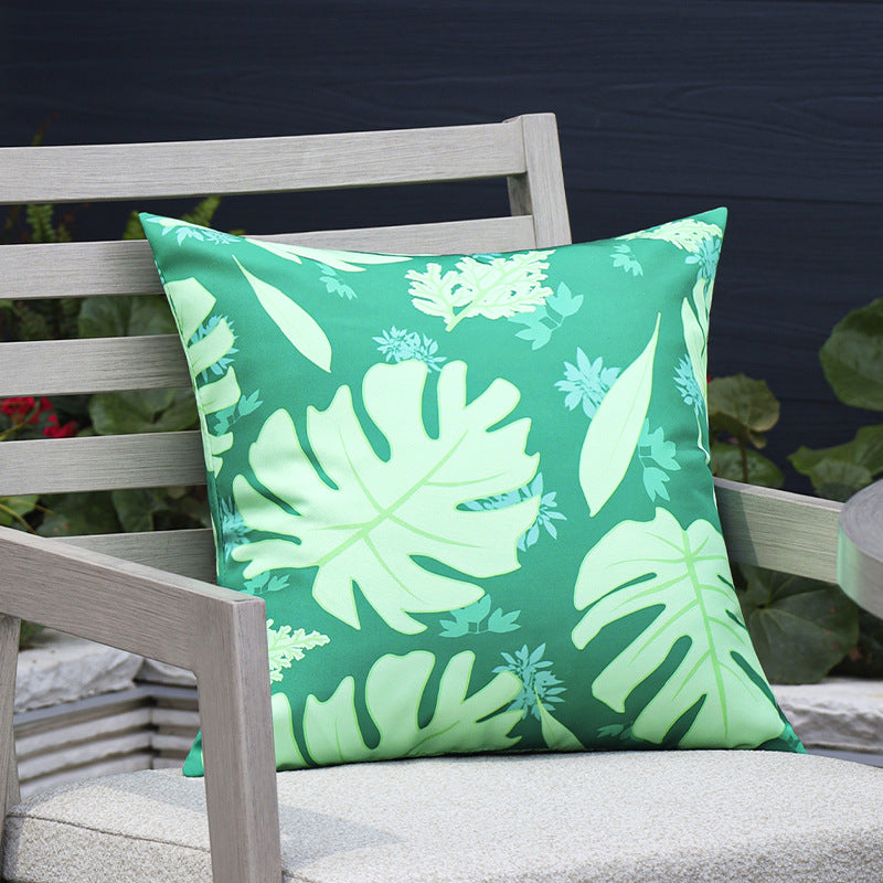 Square outdoor cushion cover made of water-repellent polyester with tropical Monstera print Stornfield