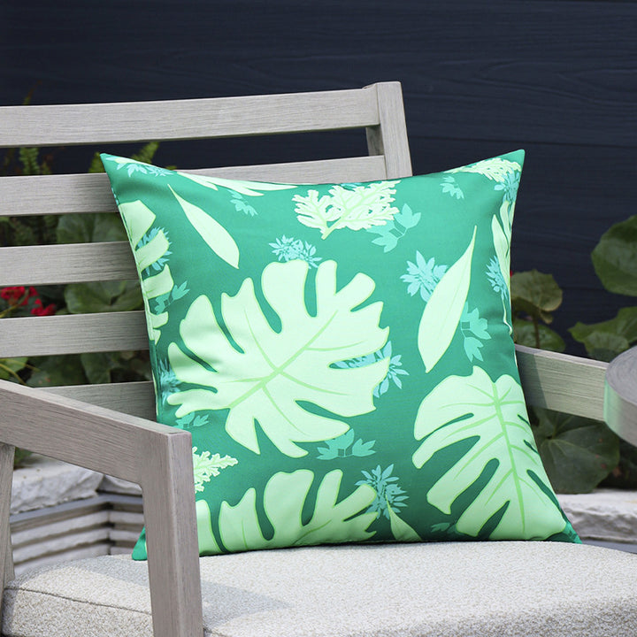 Square outdoor cushion cover made of water-repellent polyester with tropical Monstera print Stornfield