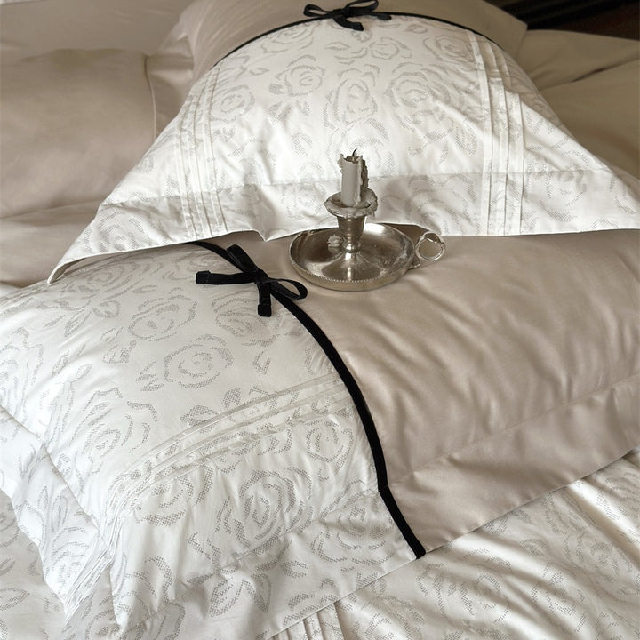 Reversible Duvet Cover Bedding Set with Quilted Jacquard Panel, Black Piped Trim & Decorative Bow Shams