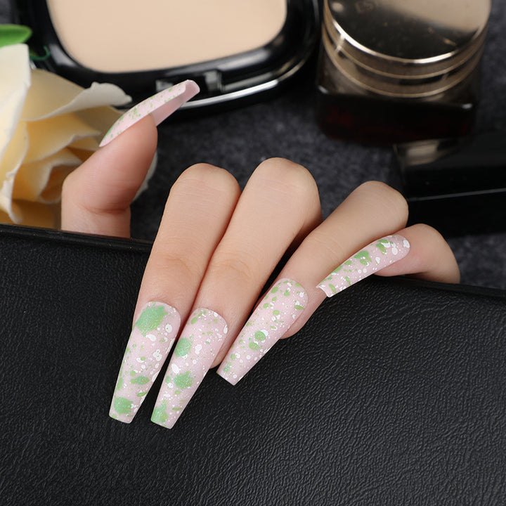Artistic splatter design artificial nails Stornfield