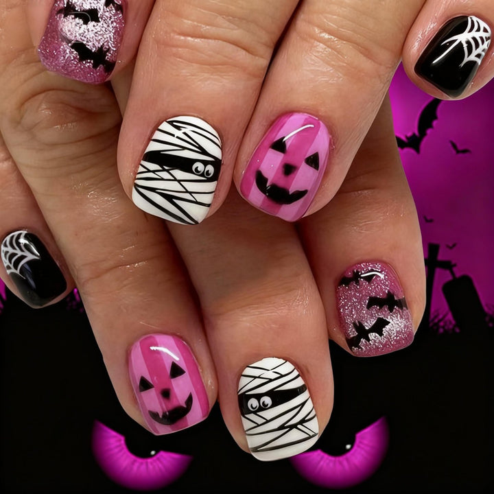 Creative nail art set with Halloween motifs and glitter accents Stornfield