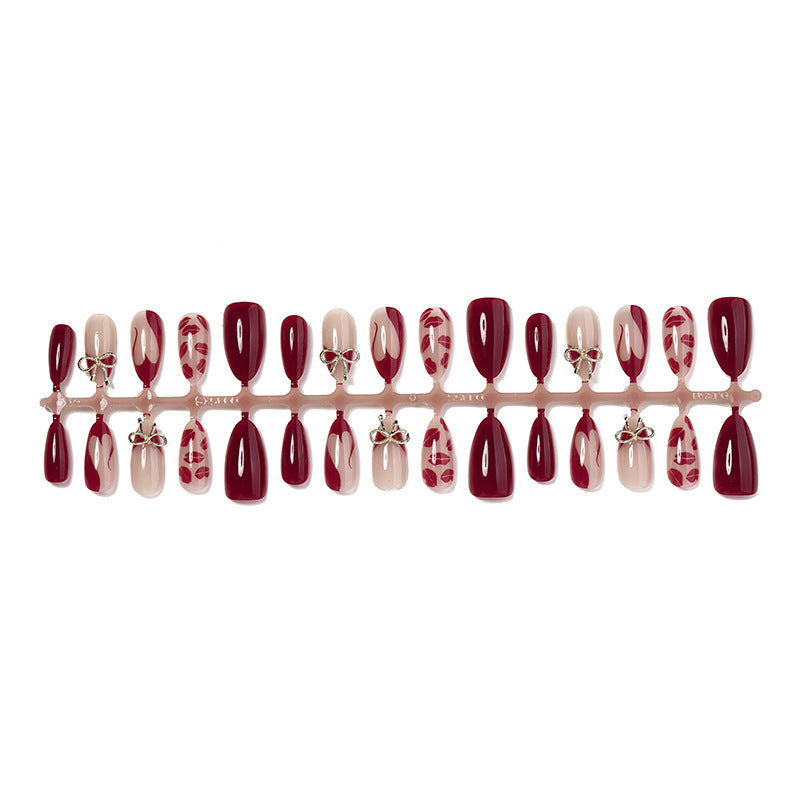Artificial nail set with elegant bow and lip designs Stornfield