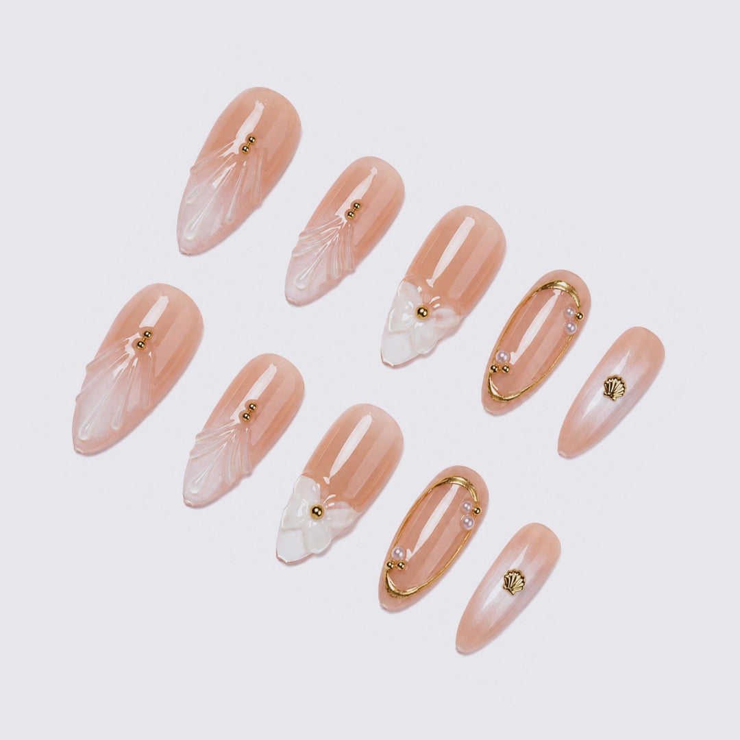 Acrylic nail set with floral 3D designs and elegant golden accents Stornfield