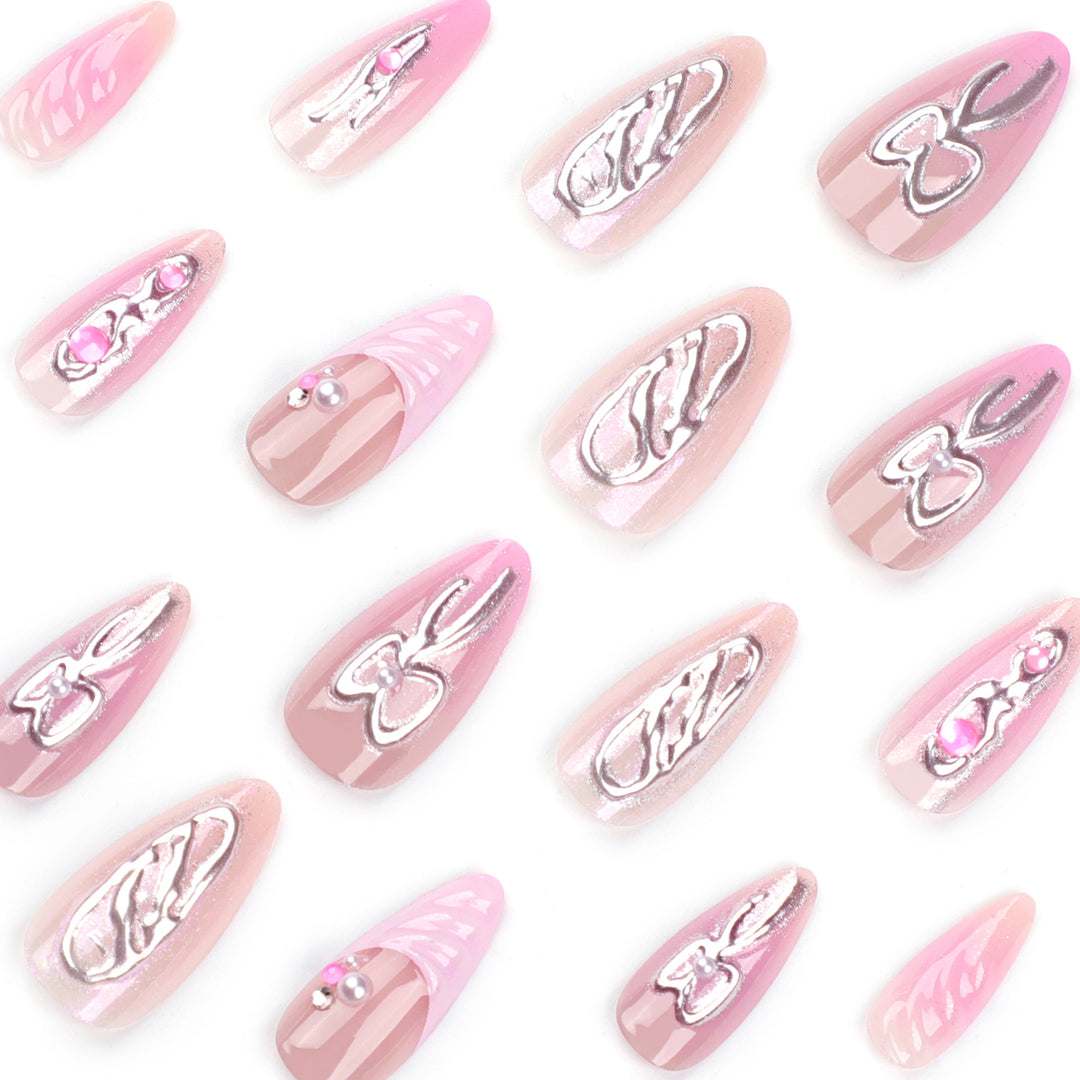 Artful stiletto nails with glitter and pearl decorations Stornfield