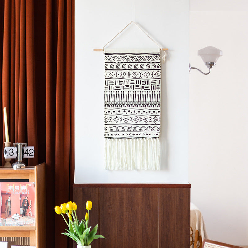 Woven cotton blend wall hanging with graphic ethnic pattern and long fringes Stornfield