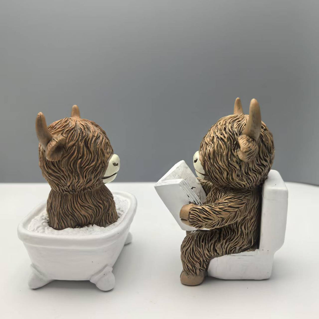 Funny decorative figure of a Highland cow in a bathtub Stornfield